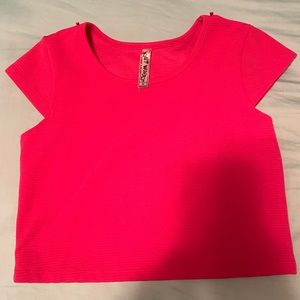 Bright pink cropped shirt